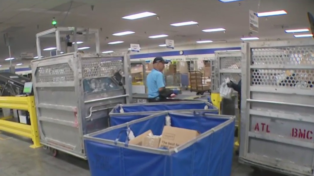 Post Office in Livermore shows off new package sorting machine