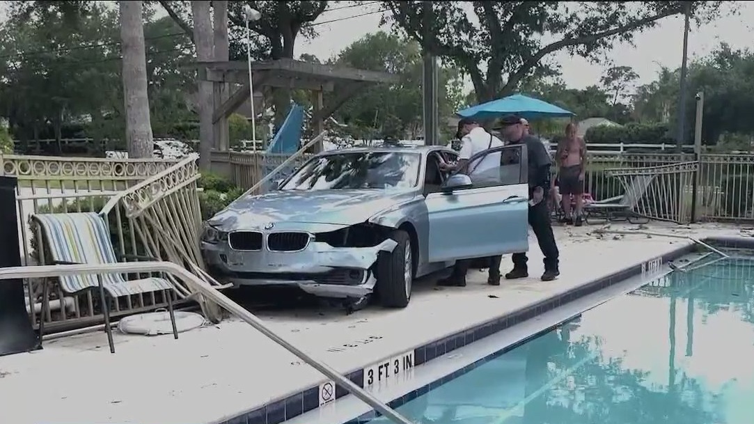 Car crashes onto Florida apartment pool deck