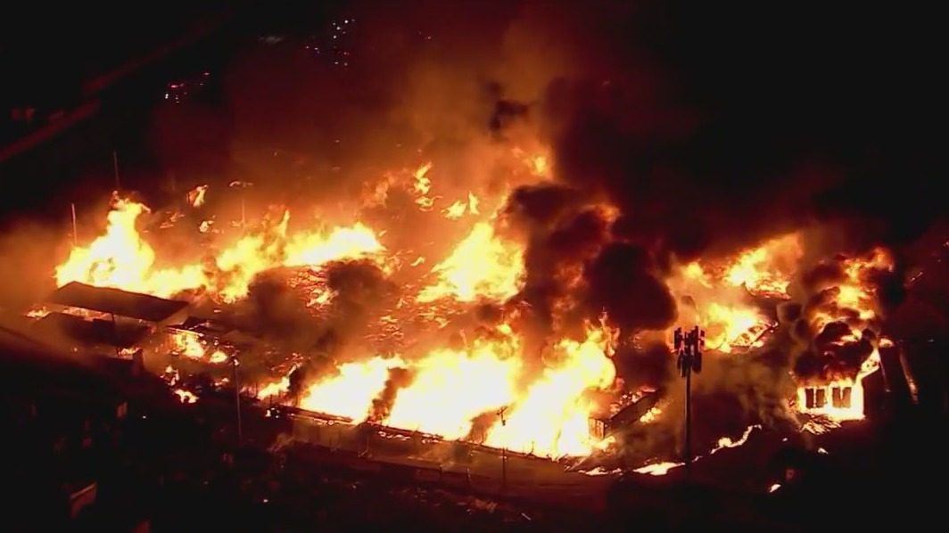 Phoenix firefighters put out hot spots of huge pallet fire