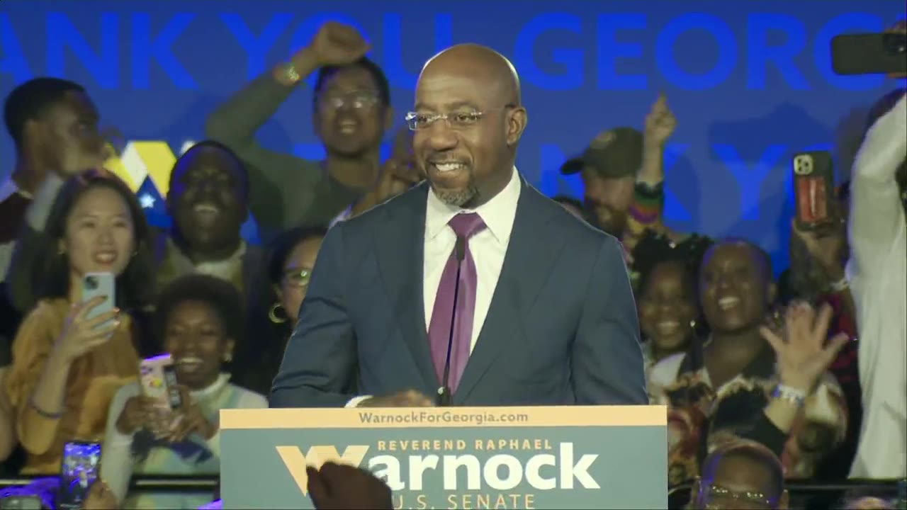 Raphael Warnock tells supporters 'The people have spoken' after claiming victory in the US Senate race