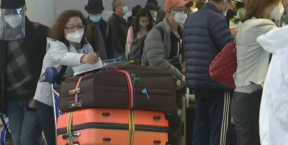 Travelers return to Sky Harbor after spending holidays away amid calls to lessen travel