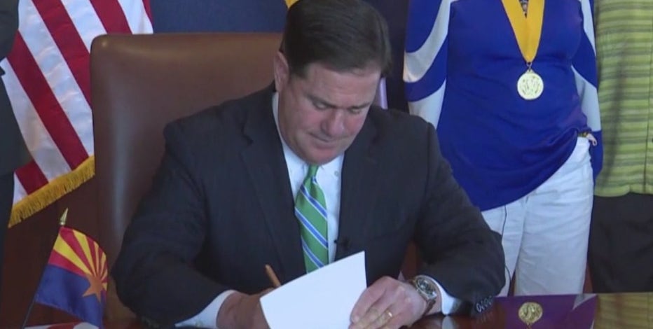 Arizona Gov. Ducey signs COVID-19 liability shield