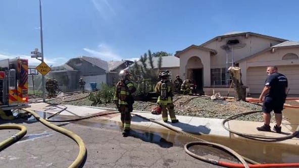 Firefighters battle double house fire in west Phoenix