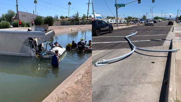 Box truck knocks down Mesa light pole, ends up in canal