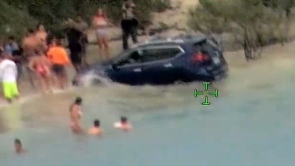 Watch: Florida driver arrested after driving onto beach, narrowly missing families