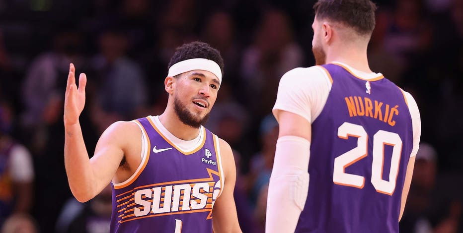 Booker scores 32, Suns hang on late to beat Warriors 119-116; Draymond Green ejected