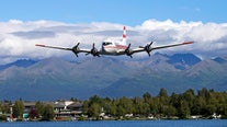 Douglas C-54 plane with 2 people on board crashes into Alaska riverbank
