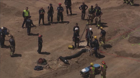 Crews rescuing man who fell down Goodyear manhole: FD