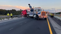 Crash leaves semi dangling off overpass on Polk Parkway
