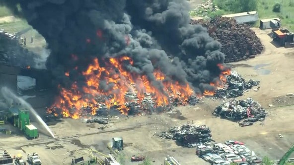 Several crews battling massive fire at junkyard in Bucks County