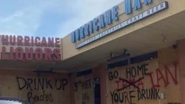 ‘Go home, Ian, you’re drunk’: Floridians use plywood to tell Hurricane Ian what they think