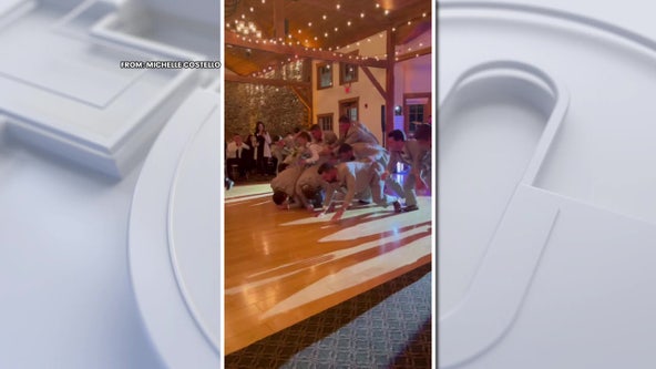 Wedding party recreates Eagles 'Tush Push' for epic reception entrance