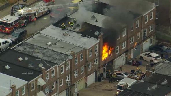 Firefighters battle blaze as flames erupt from rowhome in Northeast Philadelphia