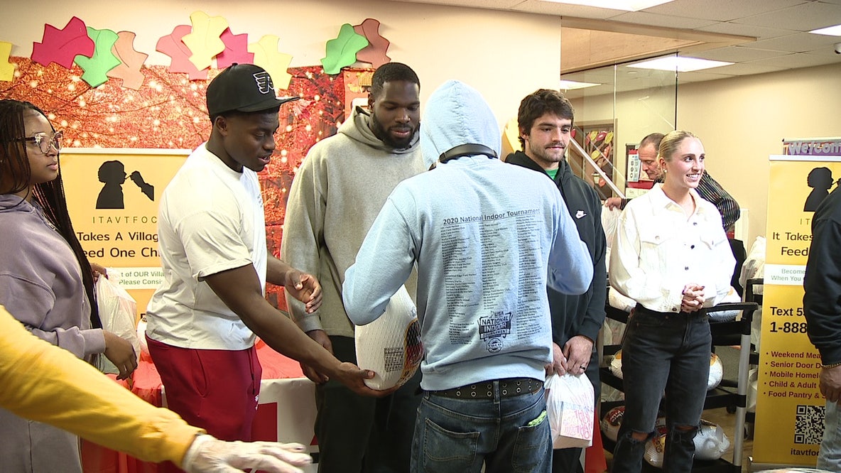Eagles players hand out 250 Thanksgiving turkeys, sides at Camden FamGiving drive