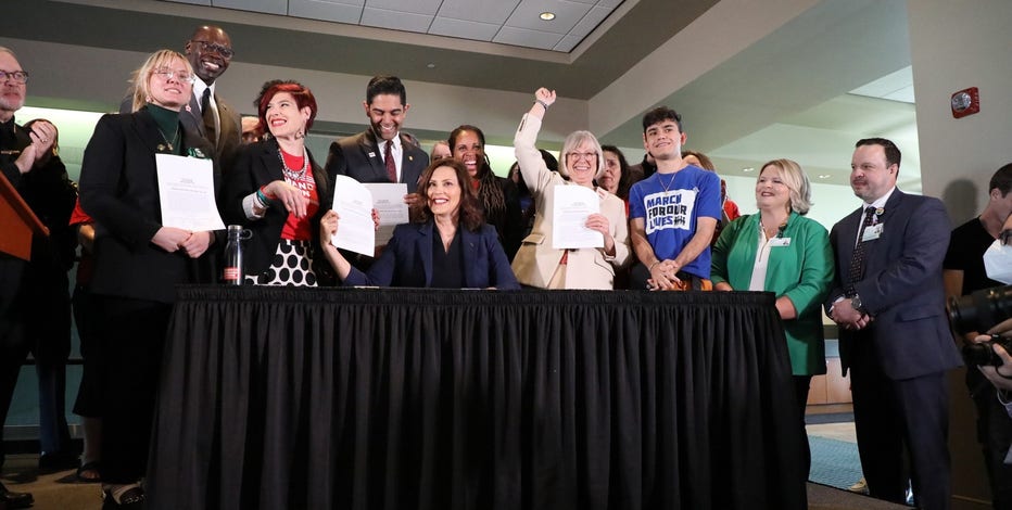 Whitmer signs safe storage and background check gun bills into law