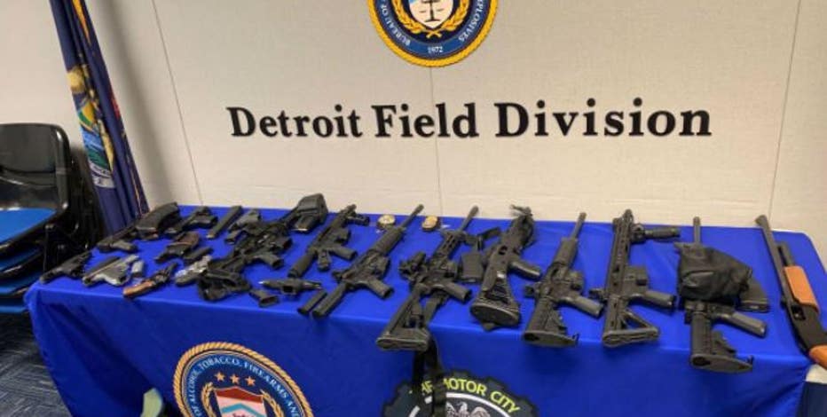 Investigators find fake fed badges, stolen guns after man allegedly shoots at wife in Detroit alley