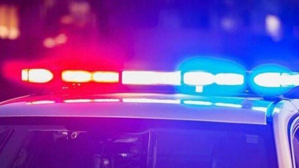 St. John police officer shoots at car driving toward him; 1 in custody