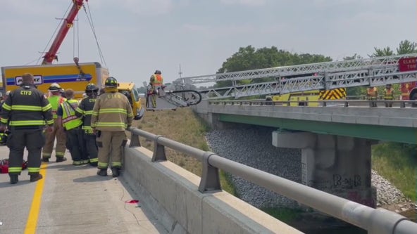 Indiana police rescue man and woman in truck hanging over side of bridge