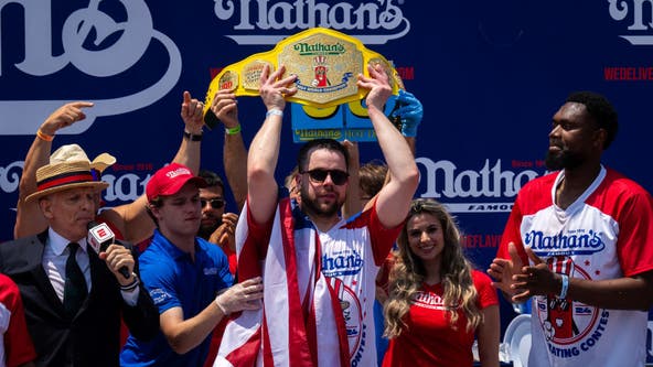 Patrick Bertoletti of Chicago wins his first men's title at annual Nathan's hot dog eating contest.