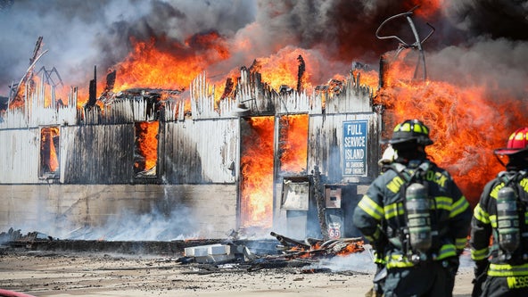 PHOTOS: Large fire destroys barn in Woodstock