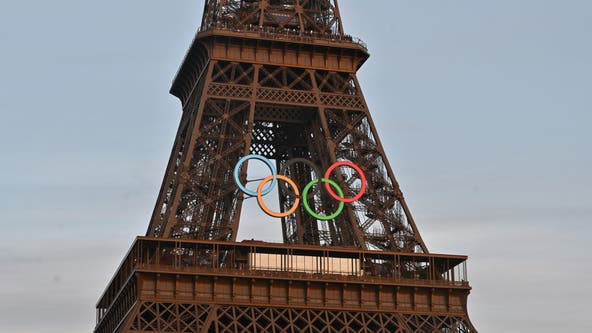 Police arrest a man climbing the Eiffel Tower, prompting an evacuation hours before closing ceremony