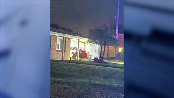 Titusville police officer crashes into garage on the way to active scene, officials say
