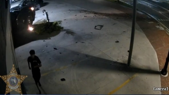 Man jogs away after flipping his car multiple times, crashing into Florida auto shop: VIDEO