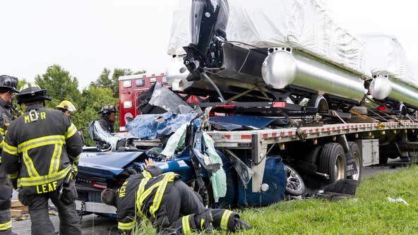 1 dead after car wedged under tractor-trailer hauling boats on I-75 in Marion County: officials