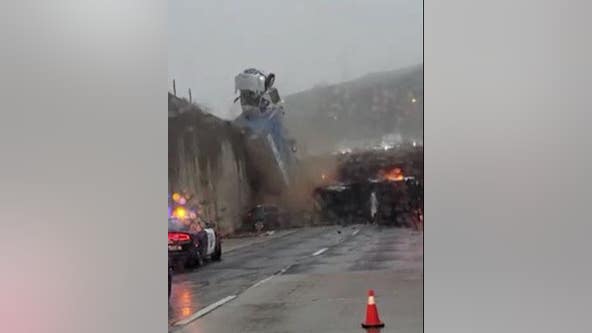 Dramatic video captures truck toppling over California freeway overpass