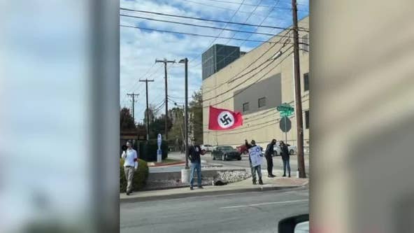 Group carries Nazi flag across street from Dallas temple