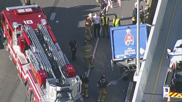 Truck hangs off I-35 bridge in Dallas
