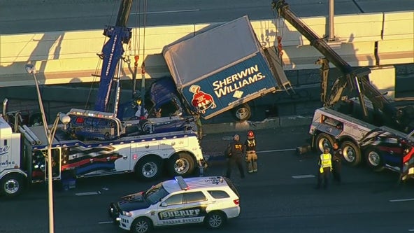 Truck hangs off I-35 bridge in Dallas, driver rescued