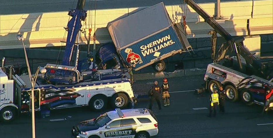 Truck hangs off I-35 bridge in Dallas, driver rescued