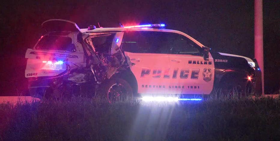 Dallas PD officer injured after squad car struck while blocking traffic