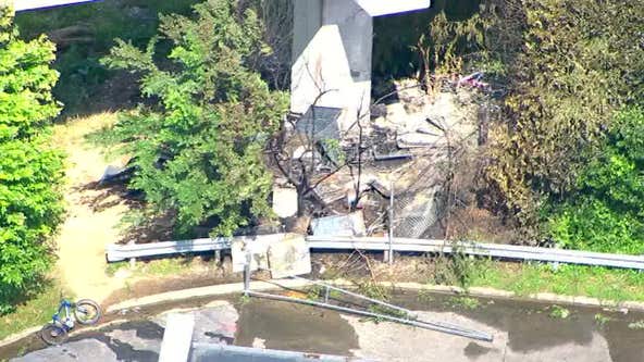 Fire under flyover briefly closes GA-400 exit to I-85