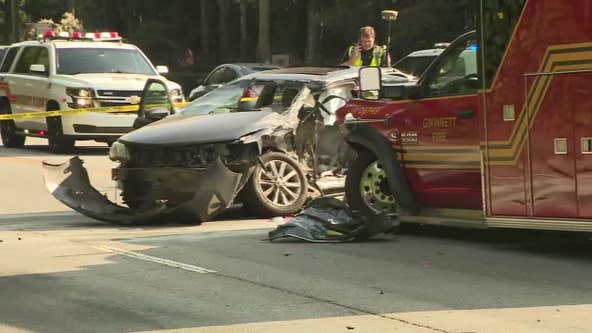 Ambulance, responding to call, crashes into car turning onto Jimmy Carter Blvd.