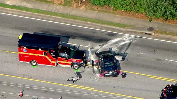 Ambulance, car crash near Norcross; one lane along Jimmy Carter Blvd. open