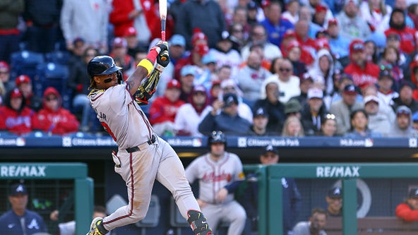 Braves rally for seven in the eighth to begin defense of NL East crown with 9-3 win over Phillies