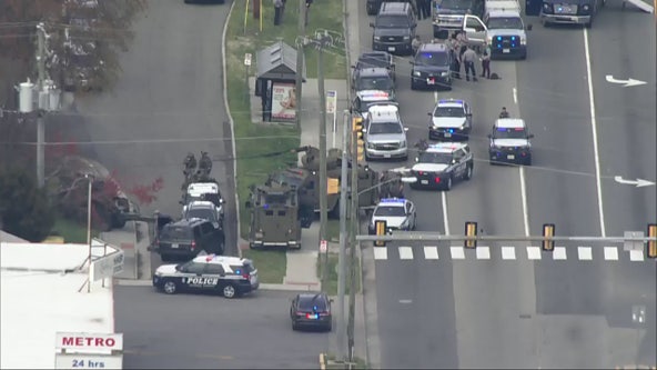 Fairfax County standoff continues after armed woman barricades herself inside car