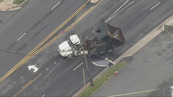 Delays in Manassas after dump truck strikes overhead cables