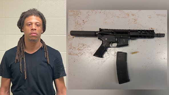Man armed with assault rifle while knocking on random doors in Germantown arrested, charged