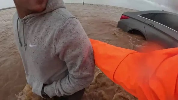 Watch storm chaser's dramatic rescue of stranded driver on flooded Texas highway