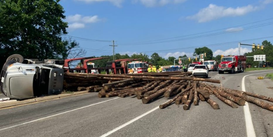 Tractor-trailer overturns, dumping logs onto highway in Virginia: police