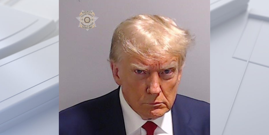 Trump mug shot released after former president turns himself in at Georgia jail