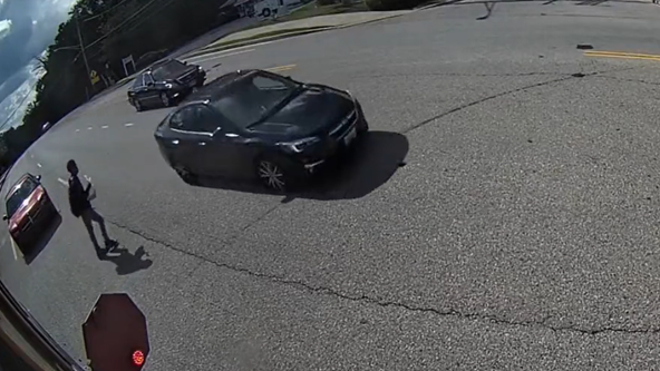 VIDEO: Close call for Montgomery County student after car flies by stopped school bus