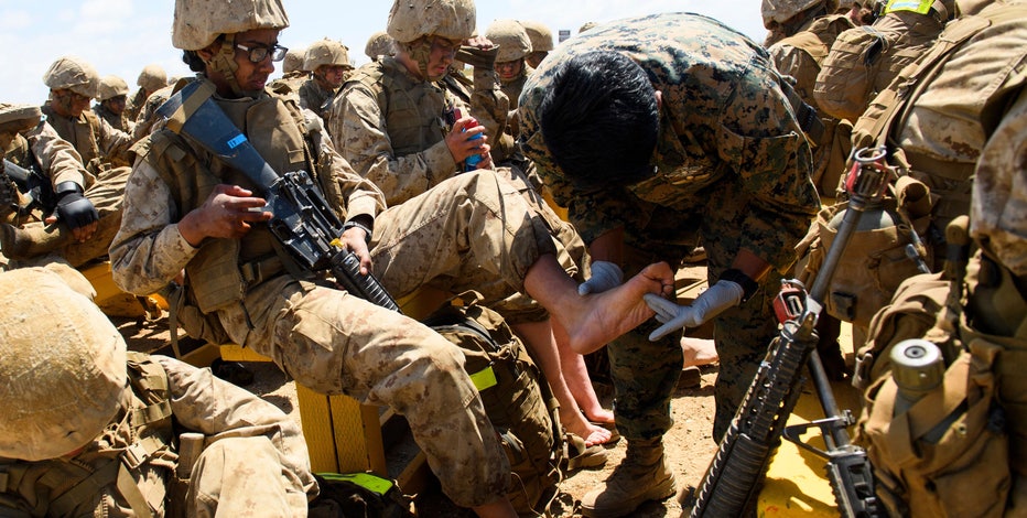 Marines inch grudgingly toward integrating women and men at boot camp