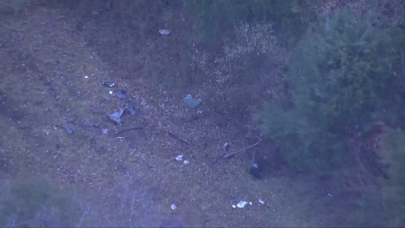 Driver hurt after vehicle crashes off roadway, overturns in wooded area in Ashburn
