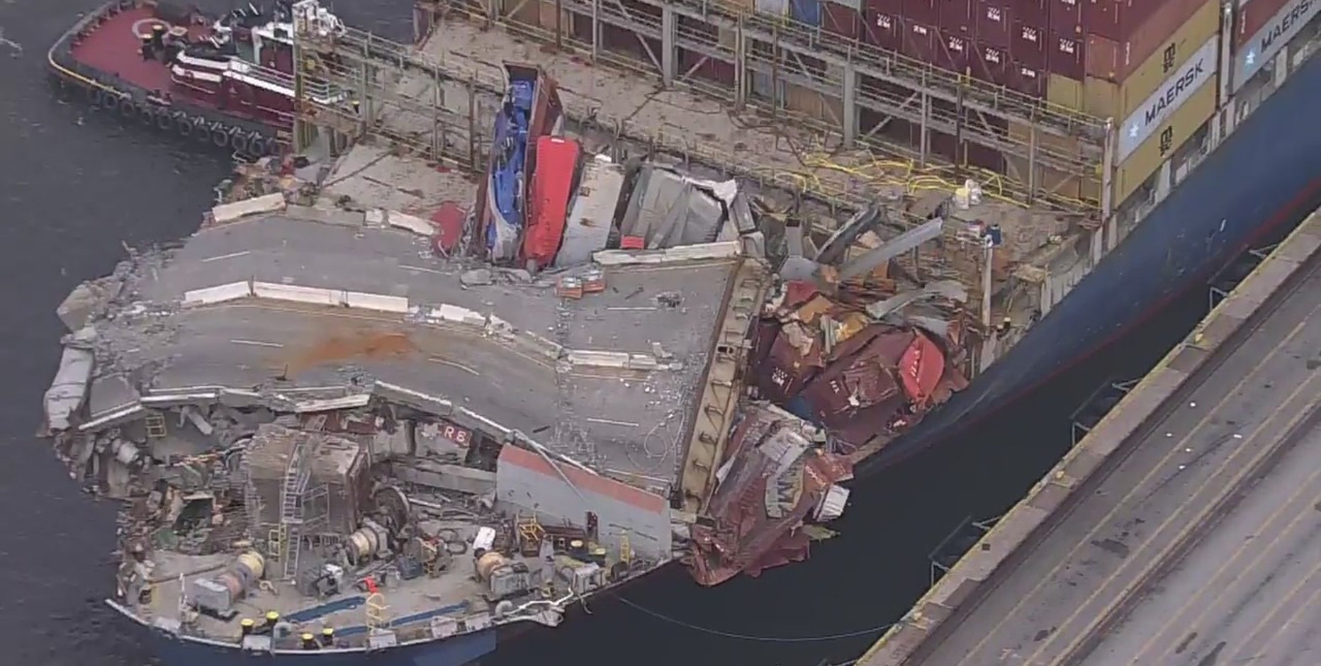 Baltimore Key Bridge collapse: Section of roadway that fell remains unbroken across container ship