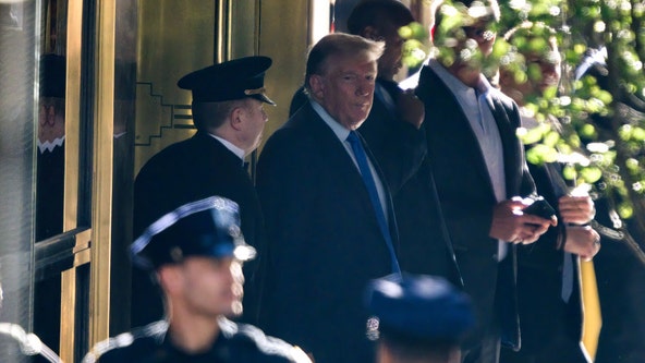 Donald Trump denounces case as 'scam' as he arrives for a New York trial over his business practices