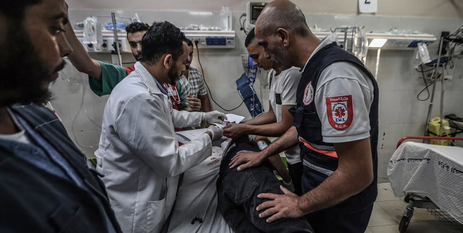 Humanitarian aid stuck at Gaza-Egypt border as Israeli siege strains hospitals